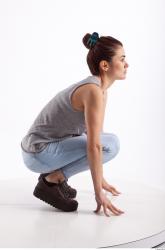 Kneeling photo references of Molly blue jeans womna singlet